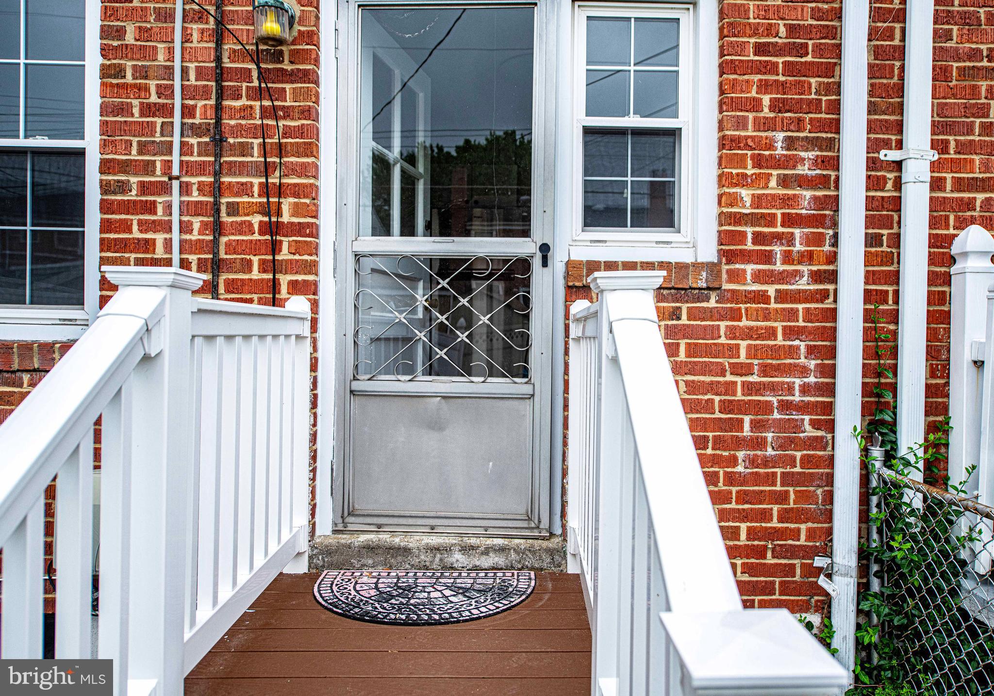 747 Middlesex Road Baltimore, MD 21221 - Photo 21 of 25 a view of a house with a door and wooden floor
