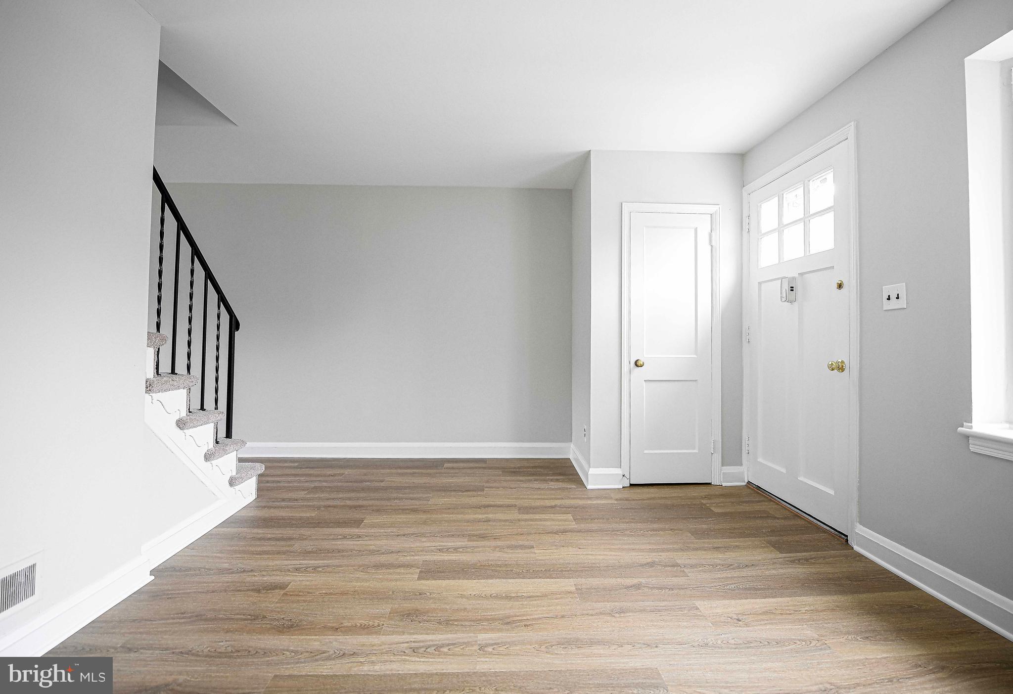 747 Middlesex Road Baltimore, MD 21221 - Photo 6 of 25 a view of entryway with wooden floor
