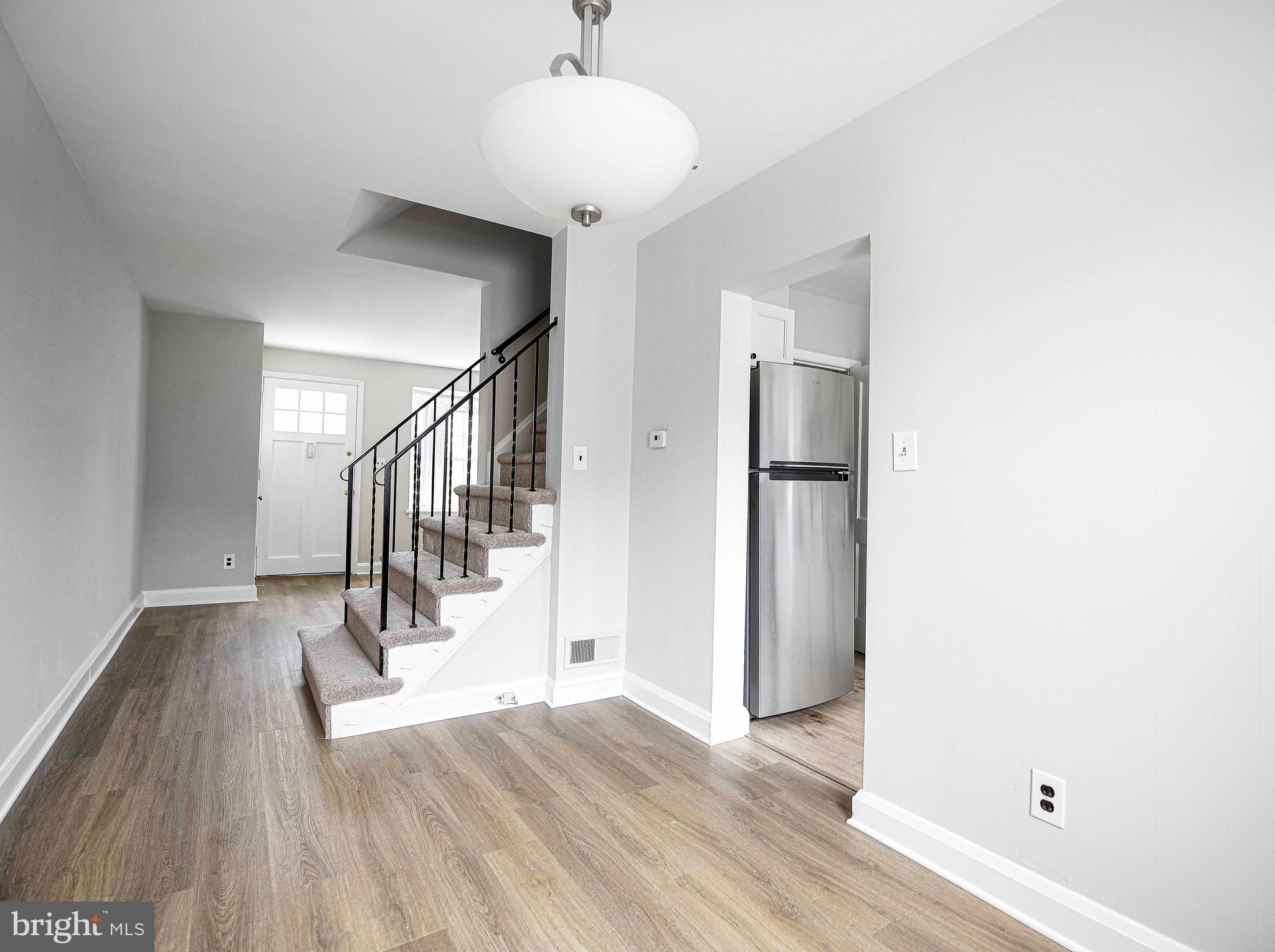 747 Middlesex Road Baltimore, MD 21221 - Photo 8 of 25 a view of entryway and hall with wooden floor