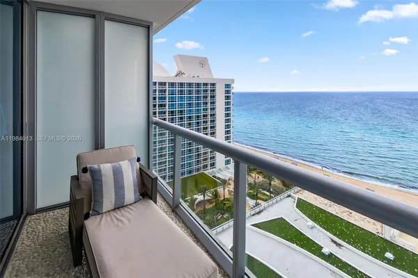 a view of balcony with furniture