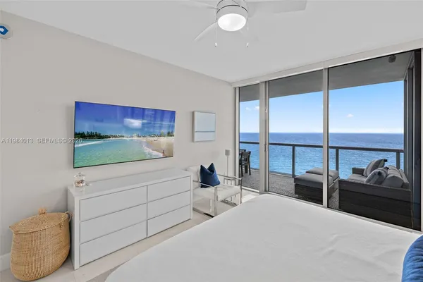 a bedroom with a bed and walk in closet