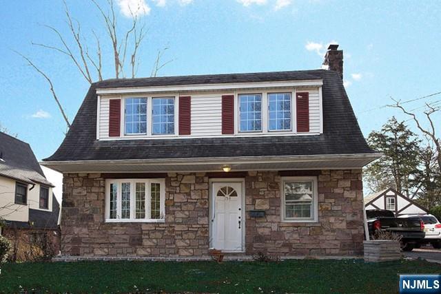154 Sussex Road Tenafly, NJ 07670 - Photo 1 of 12 a front view of a house with garden
