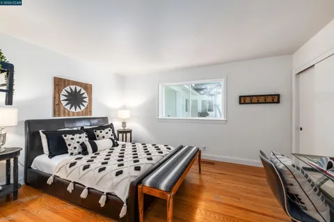 a bed room with a bed and a window