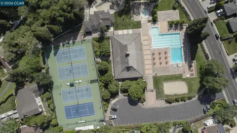 an aerial view of a house with outdoor space patio and lake view