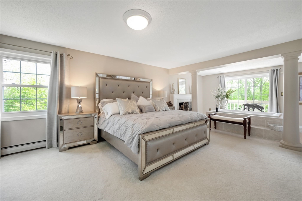63 Parker Road Shirley, MA 01464 - Photo 14 of 32 a spacious bedroom with a bed and a window
