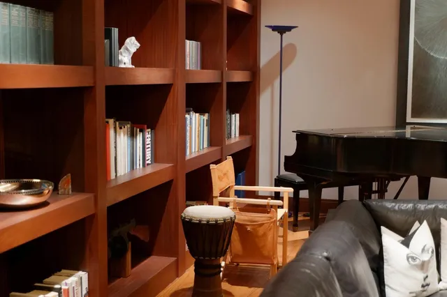 a living room with furniture a rug and a window