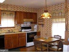 160 Captain Road Manahawkin, NJ 08050 - Photo 12 of 24 a kitchen with a table and chairs in it