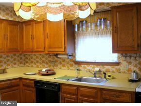 160 Captain Road Manahawkin, NJ 08050 - Photo 13 of 24 a kitchen with a sink and cabinets