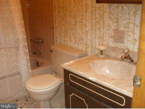 160 Captain Road Manahawkin, NJ 08050 - Photo 15 of 24 a bathroom with a granite countertop sink toilet and shower