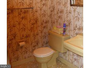 160 Captain Road Manahawkin, NJ 08050 - Photo 17 of 24 a bathroom with a toilet and a sink