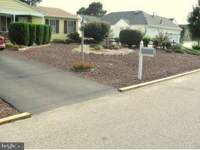 160 Captain Road Manahawkin, NJ 08050 - Photo 3 of 24 a backyard of a house with yard fire pit and outdoor seating