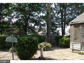 160 Captain Road Manahawkin, NJ 08050 - Photo 24 of 24 a front view of a house with garden