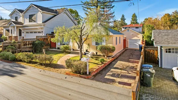 front view of a house with a small yard