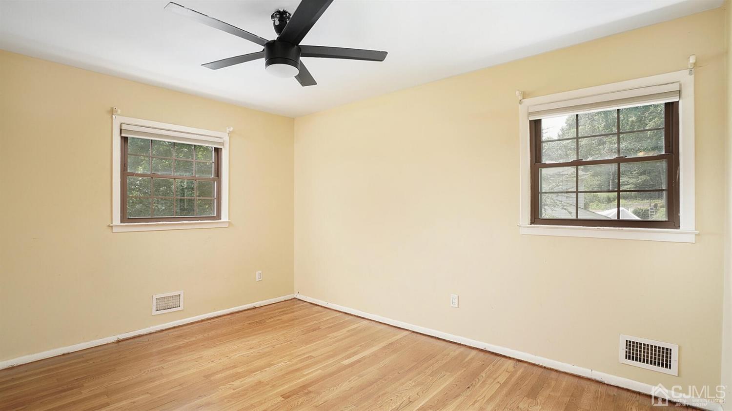 50 Meyer Road Edison, NJ 08817 - Photo 14 of 31 a view of an empty room with a window and wooden floor