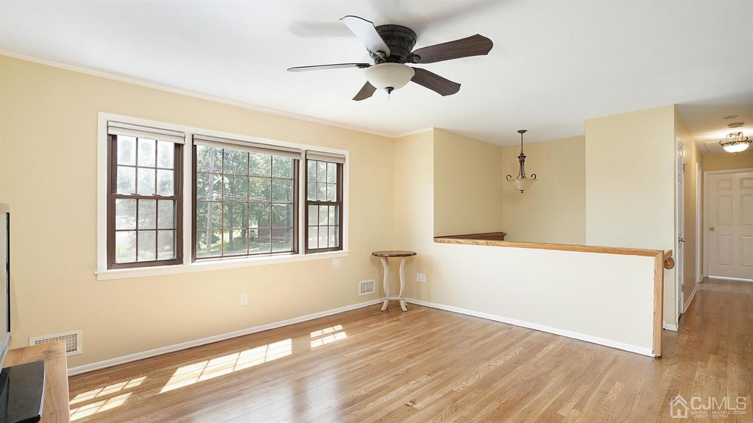 50 Meyer Road Edison, NJ 08817 - Photo 4 of 31 a view of an empty room with wooden floor and a window