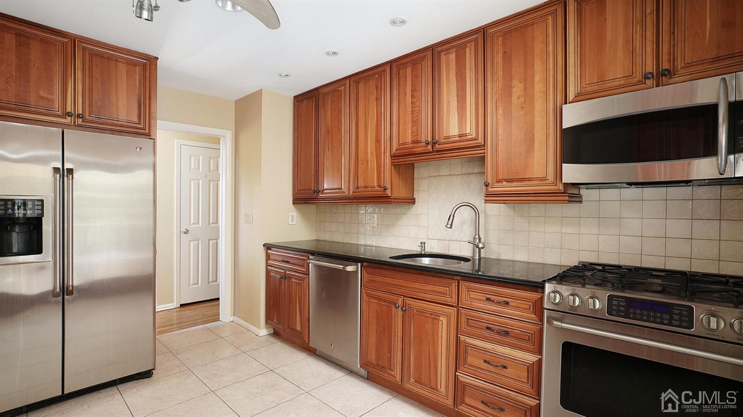 50 Meyer Road Edison, NJ 08817 - Photo 8 of 31 a kitchen with stainless steel appliances granite countertop a refrigerator stove and microwave