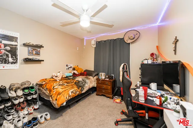 a bed room with a bed and a view of room