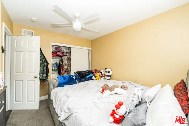 a bed room with a bed and a chandelier