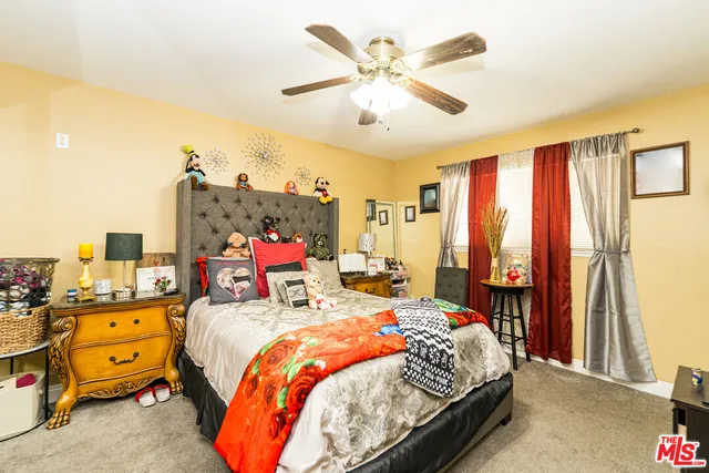 a bedroom with a bed and furniture