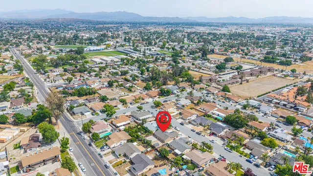an aerial view of residential houses with outdoor space