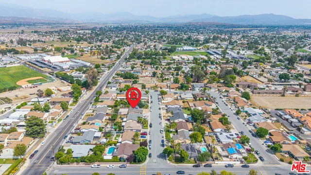 a kitchen with cabinets appliances a sink and a microwave