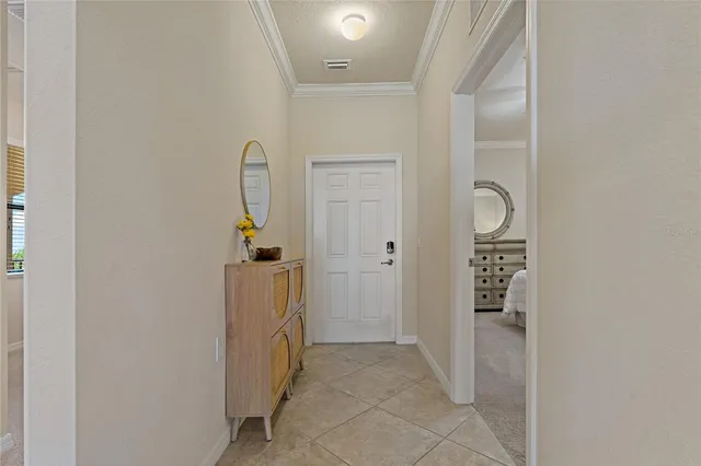 an aerial view of a house with a lake view