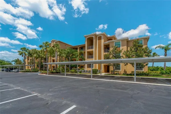 an aerial view of a houses with a swimming pool