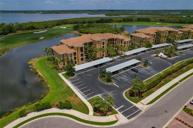 a view of a swimming pool with a yard