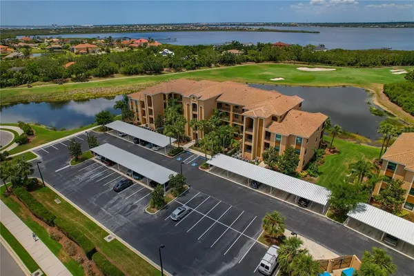 a view of a swimming pool with sitting area