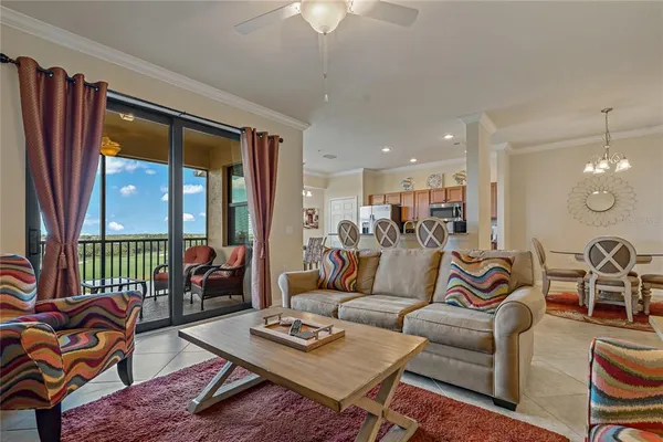 a bedroom with furniture and a large window