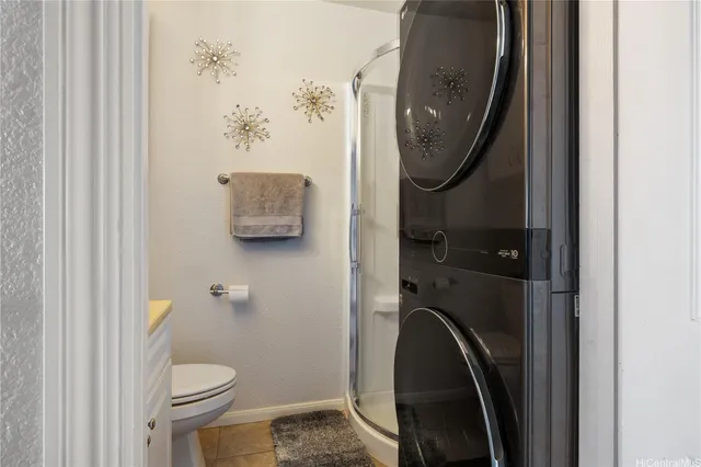 a bathroom with a toilet and a mirror