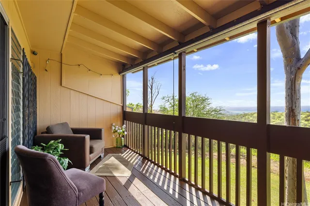 a view of balcony with furniture
