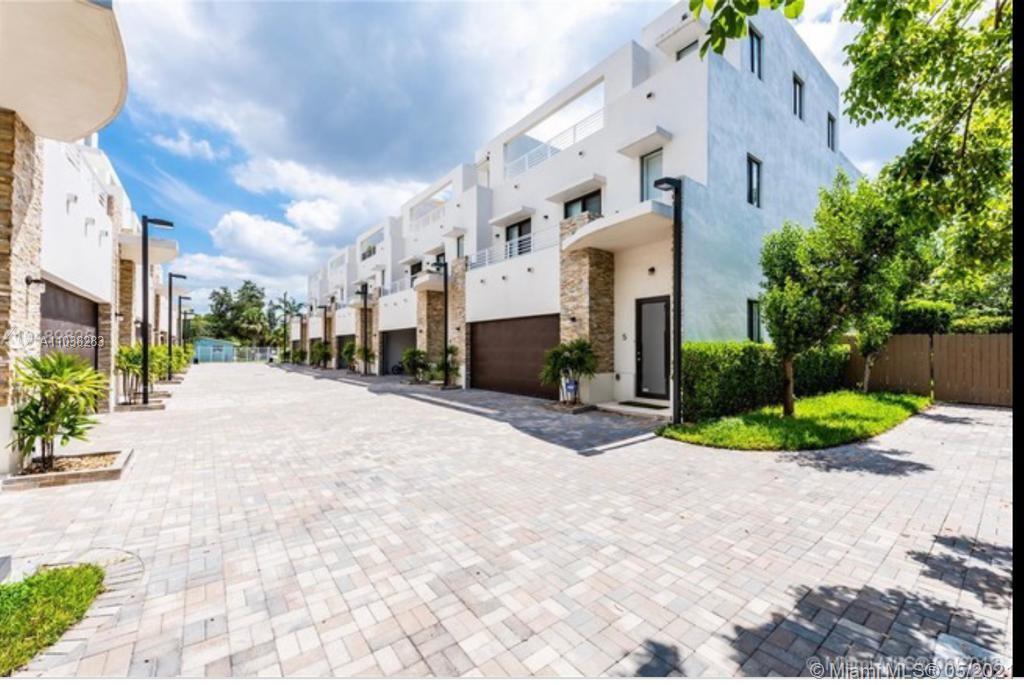 3318 Day Avenue, Unit 2 Miami, FL 33133 - Photo 1 of 29 a view of a building with a yard