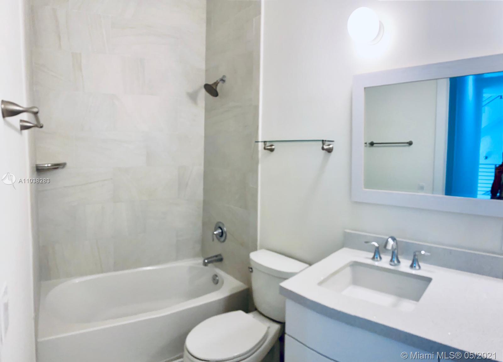 3318 Day Avenue, Unit 2 Miami, FL 33133 - Photo 11 of 29 a bathroom with a sink toilet and shower