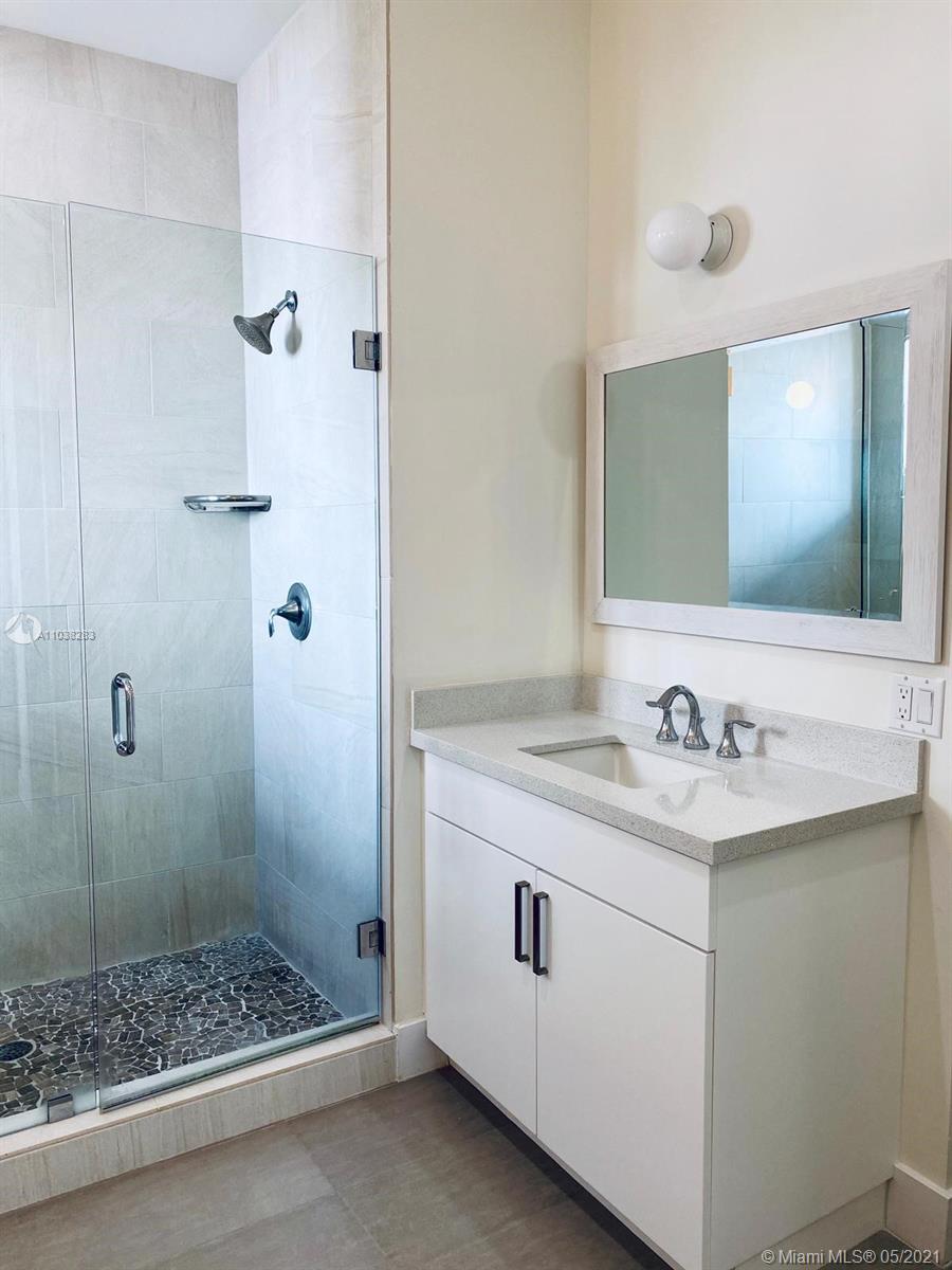 3318 Day Avenue, Unit 2 Miami, FL 33133 - Photo 15 of 29 a bathroom with a sink a toilet and shower