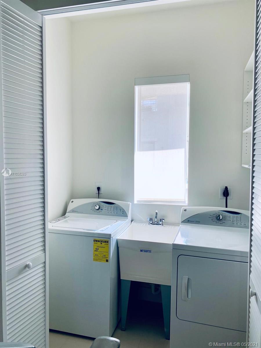 3318 Day Avenue, Unit 2 Miami, FL 33133 - Photo 16 of 29 a bathroom with a sink and a mirror