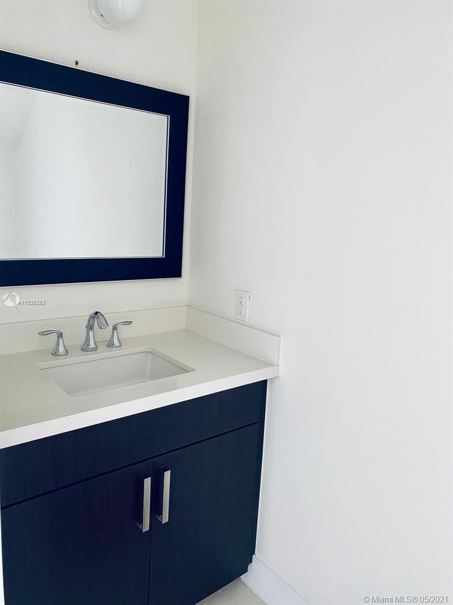 3318 Day Avenue, Unit 2 Miami, FL 33133 - Photo 17 of 29 a bathroom with a sink and a mirror