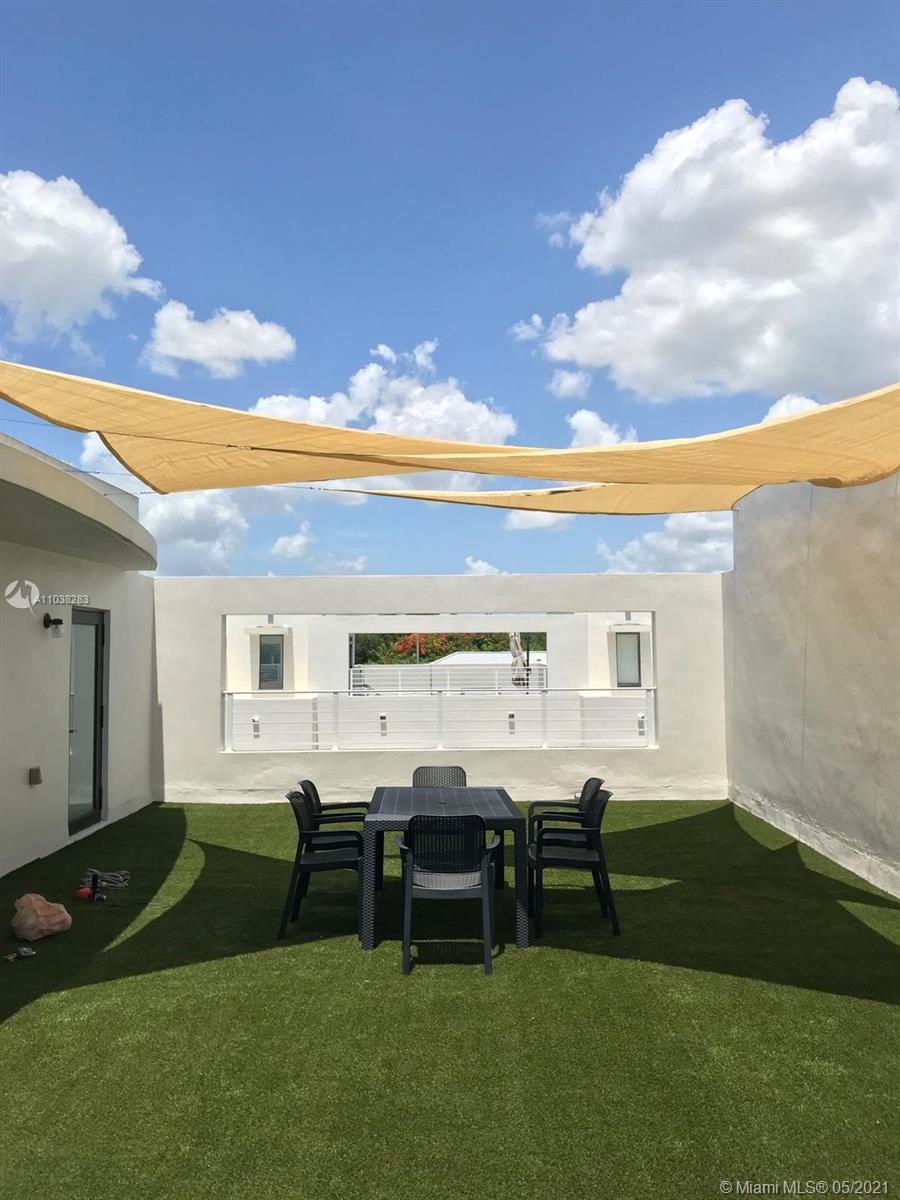3318 Day Avenue, Unit 2 Miami, FL 33133 - Photo 26 of 29 a view of a house with backyard porch and sitting area