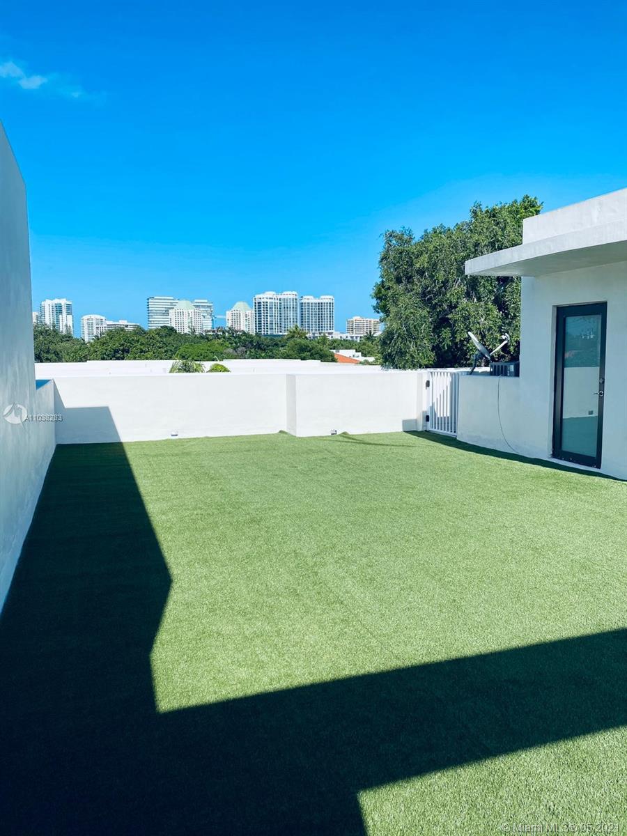 3318 Day Avenue, Unit 2 Miami, FL 33133 - Photo 27 of 29 a view of a lake with a big yard