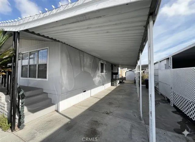 a view of a porch with wooden floor and stairs
