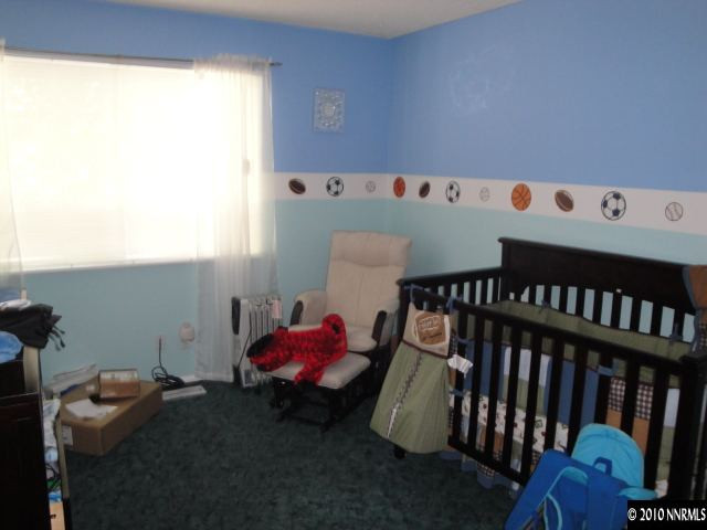 3320 Kings Row Reno, NV 89503 - Photo 7 of 9 a bedroom with furniture and a window