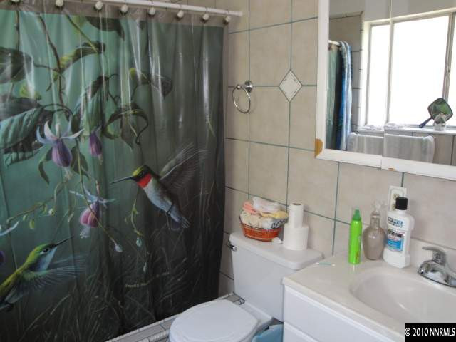 3320 Kings Row Reno, NV 89503 - Photo 8 of 9 a bathroom with a sink toilet and shower
