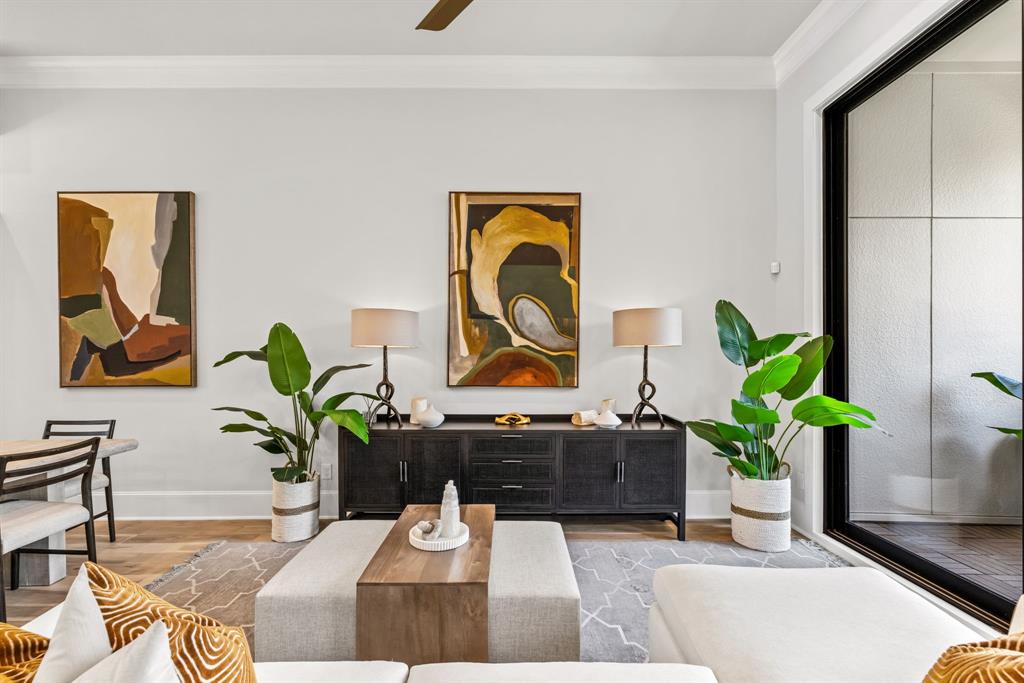 5461 Patterson Court Irving, TX 75039 - Photo 19 of 40 a living room with painting on the wall and a potted plant