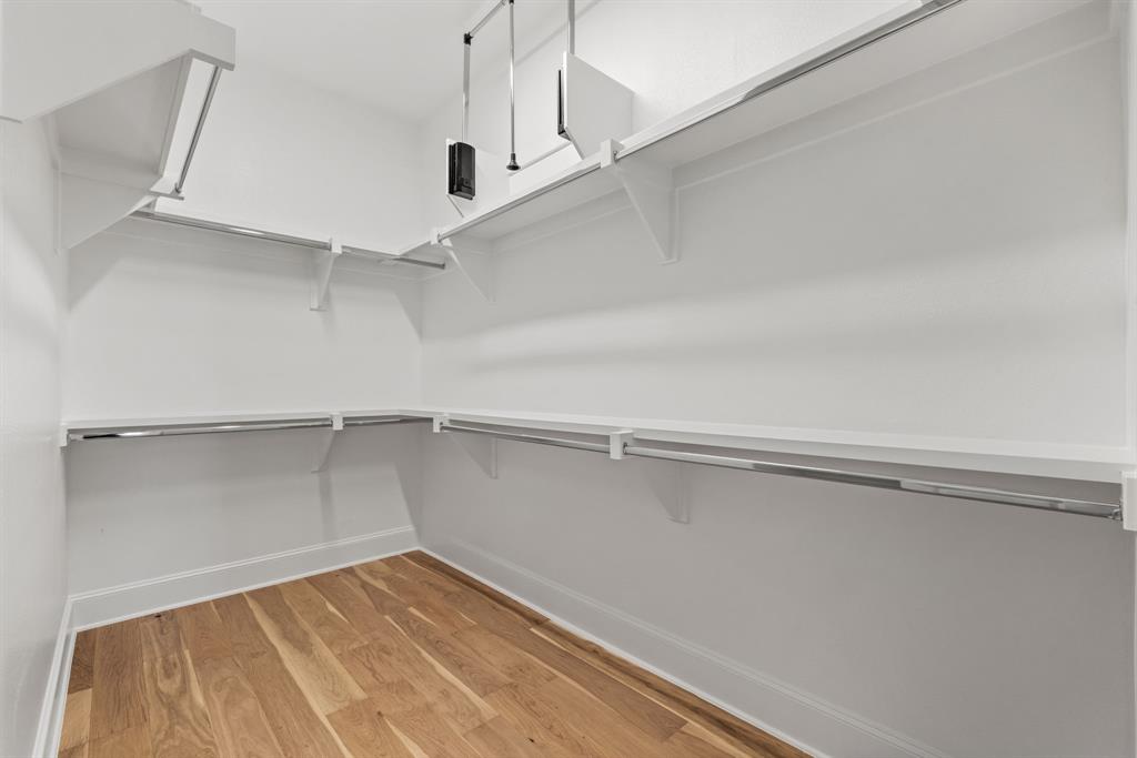 5461 Patterson Court Irving, TX 75039 - Photo 29 of 40 a view of an empty walk in closet