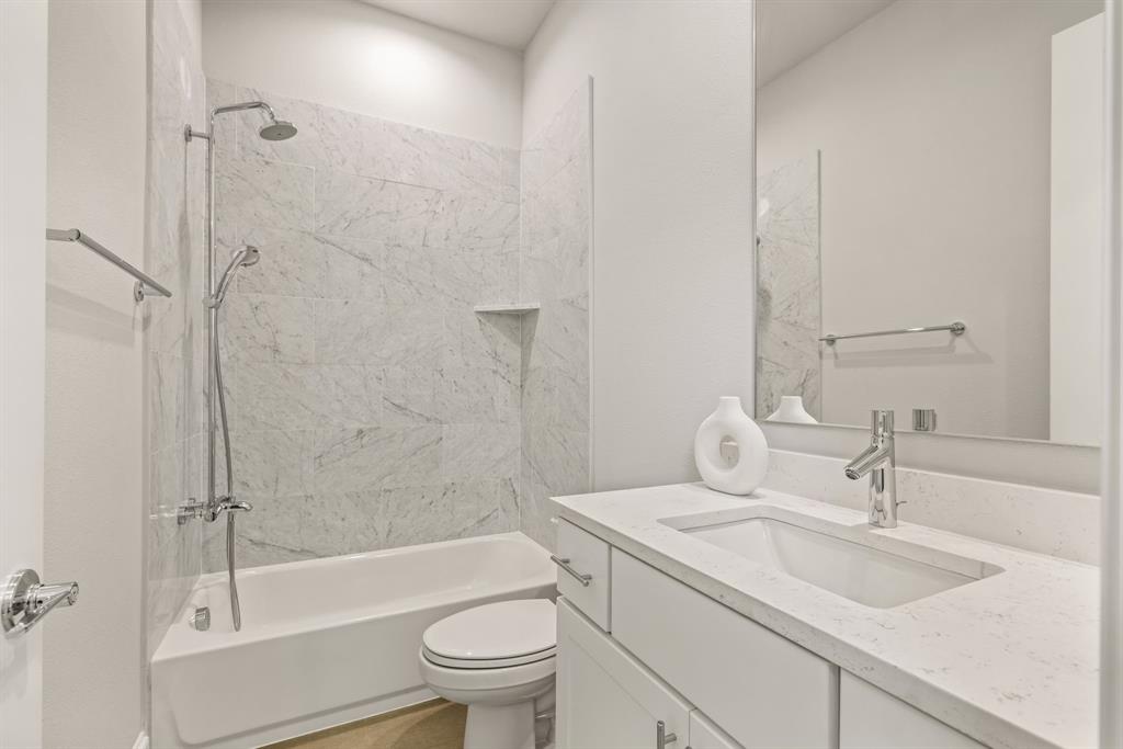 5461 Patterson Court Irving, TX 75039 - Photo 35 of 40 a bathroom with a sink toilet and shower