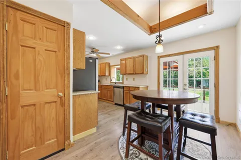 a view of a dining room with furniture and a window