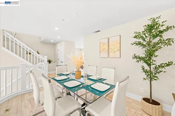 a kitchen with a table and chairs in it