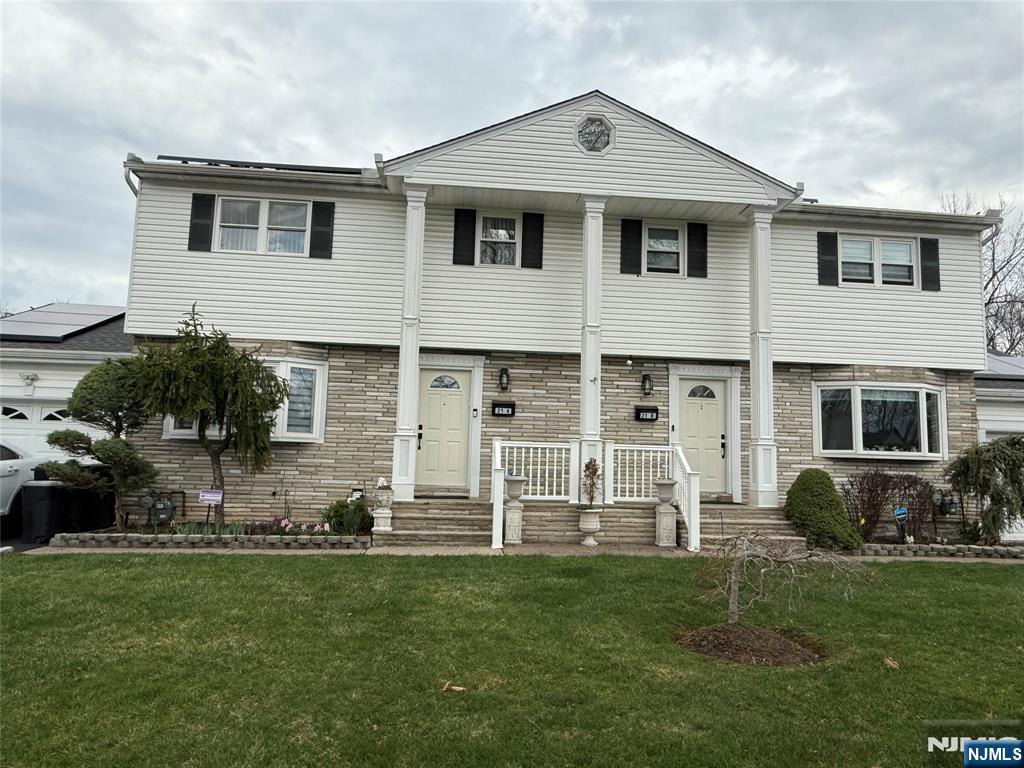 21 A Millar Court Paramus, NJ 07652 - Photo 1 of 24 a front view of a house with a yard