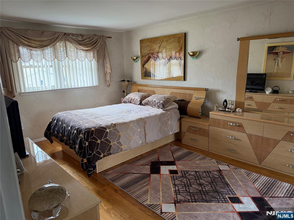 21 A Millar Court Paramus, NJ 07652 - Photo 12 of 24 a bedroom with a bed and dresser
