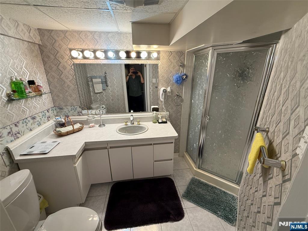 21 A Millar Court Paramus, NJ 07652 - Photo 19 of 24 a bathroom with a sink a toilet and shower